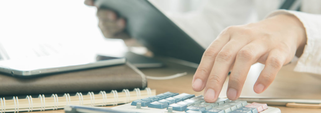 Businessman using a calculator