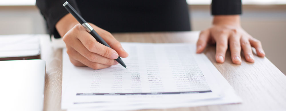 business woman looking through finance documents